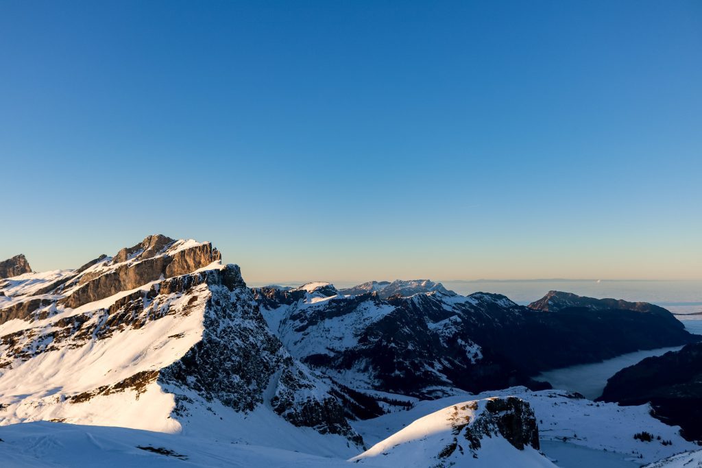 Snowy mountain panorama under a clear blue sky above Engelberg